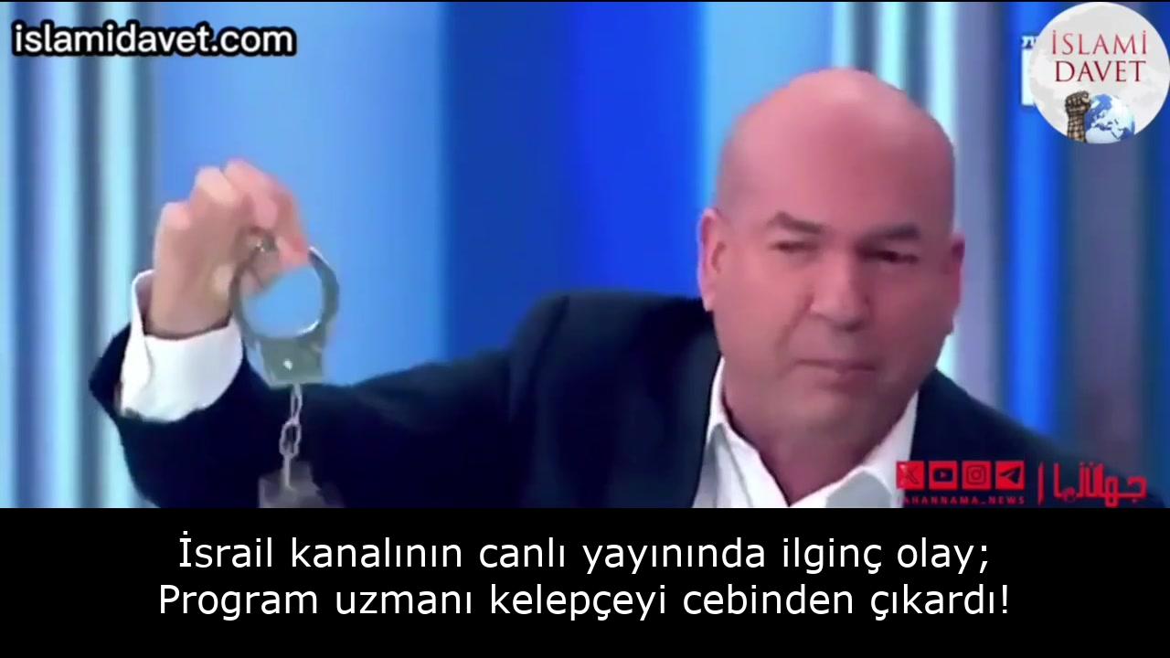 İsrail kanalının canlı yayınında ilginç olay; Program uzmanı kelepçeyi cebinden çıkardı! 23