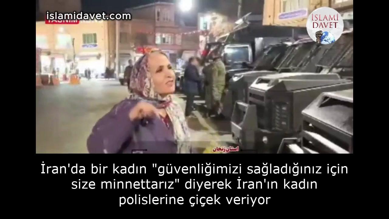 İran'da bir kadın "güvenliğimizi sağladığınız için size minnettarız" diyerek İran'ın kadın polislerine çiçek veriyor 58